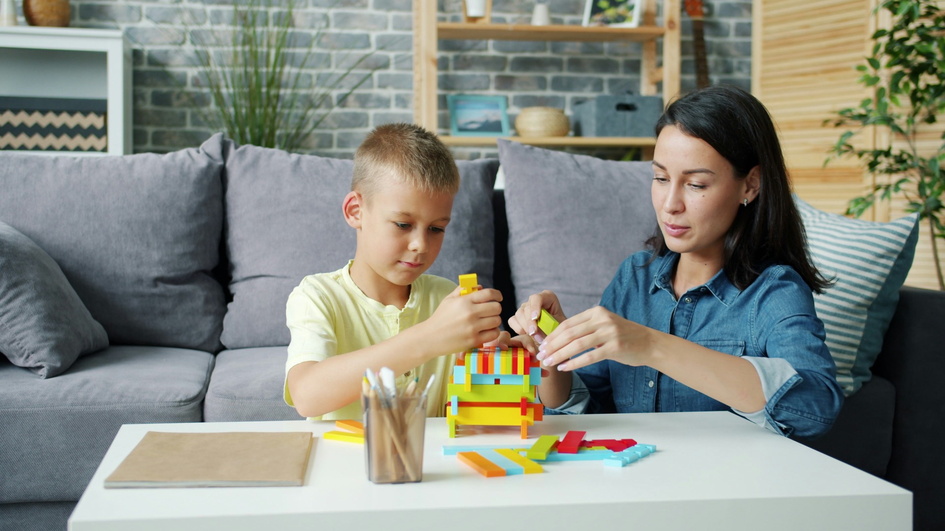 Parent and child playing with building blocks